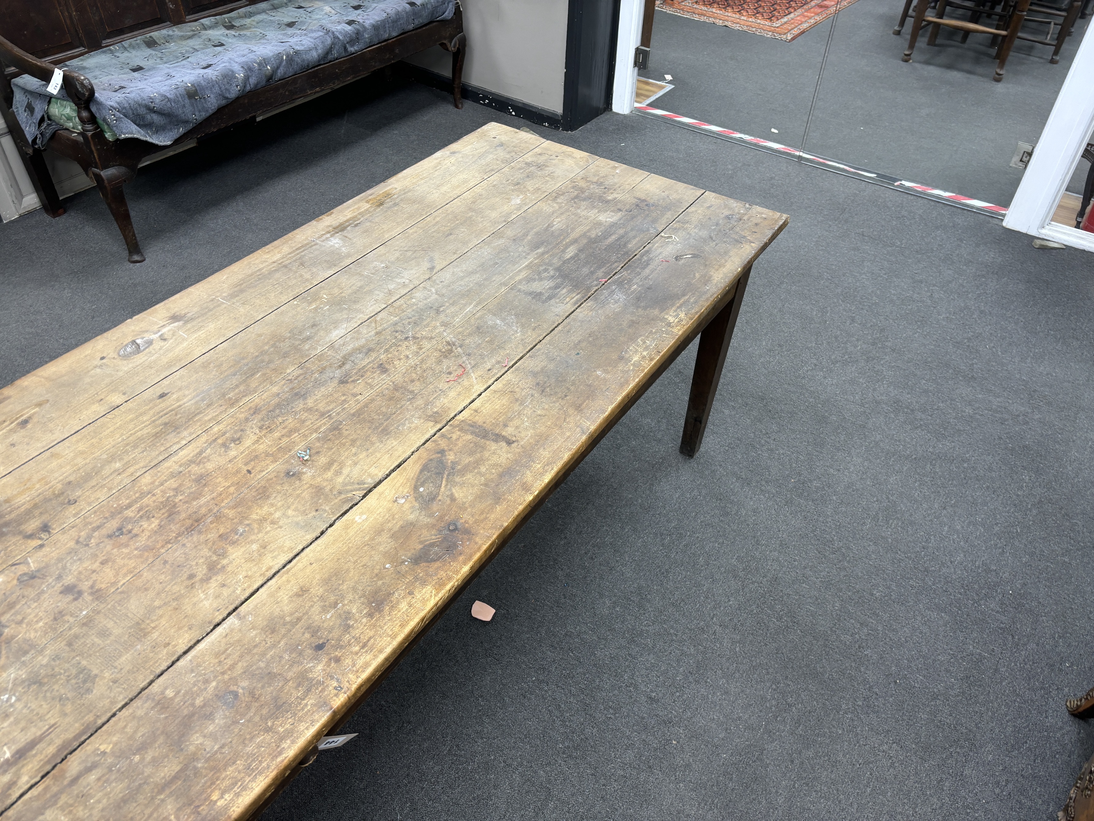 A large 19th century French rectangular fruitwood farmhouse table, fitted drawer, length 290cm, width 83cm, height 75cm